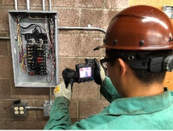 A person in a helmet using a camera

AI-generated content may be incorrect.